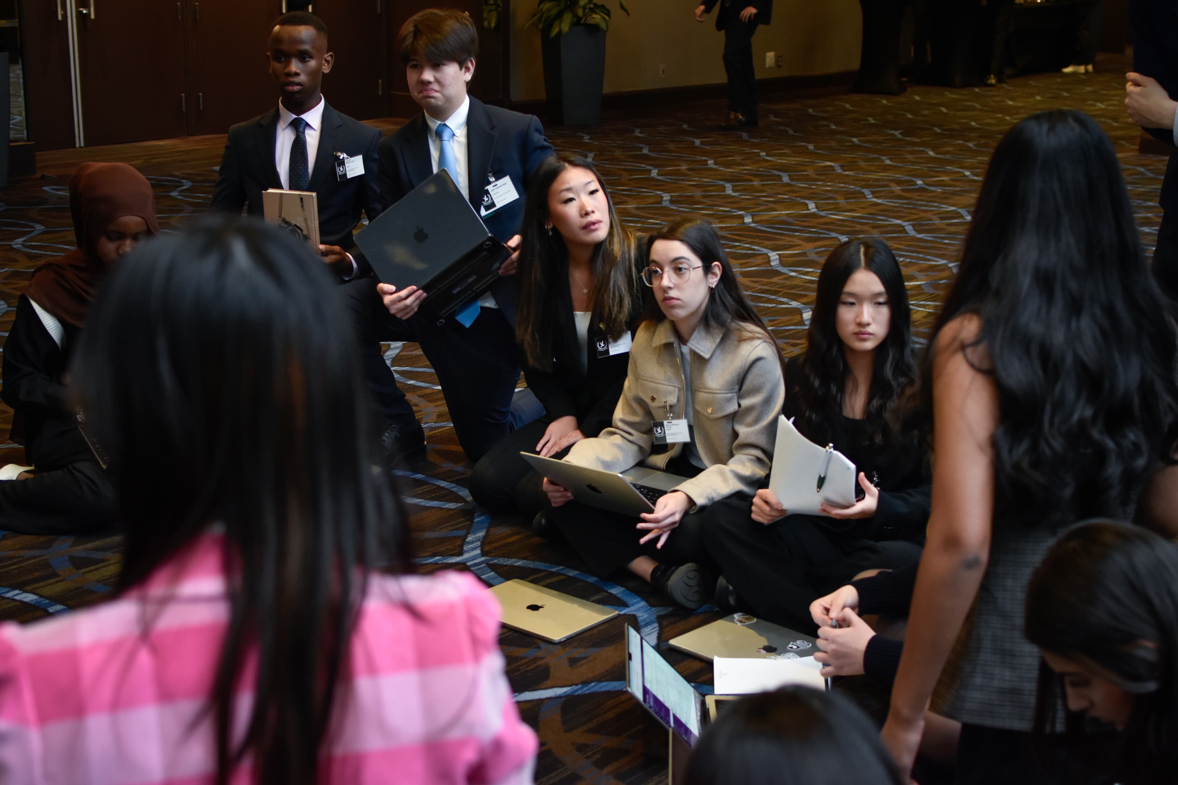 Delegates debating during session