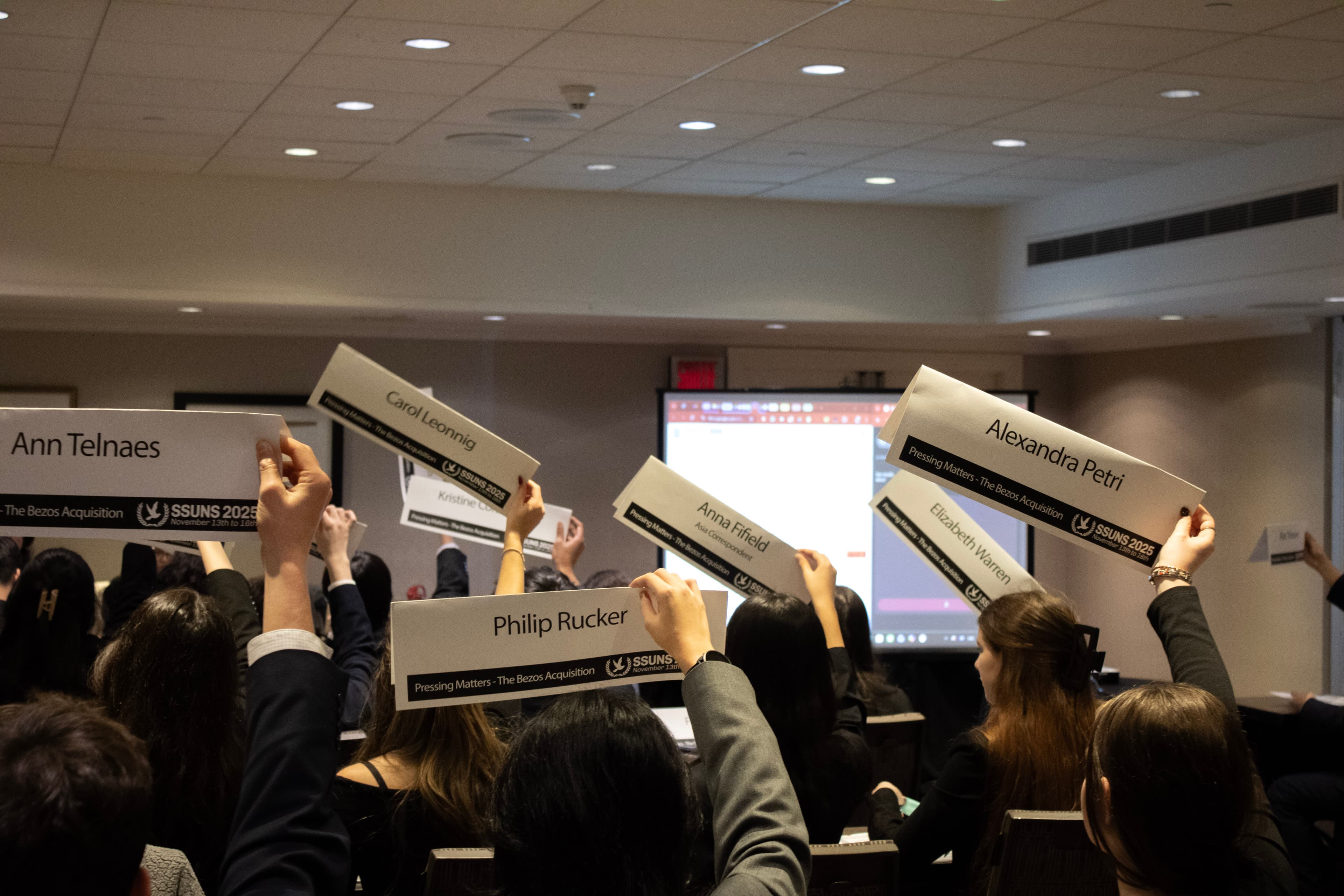 Delegates discussing draft resolution text